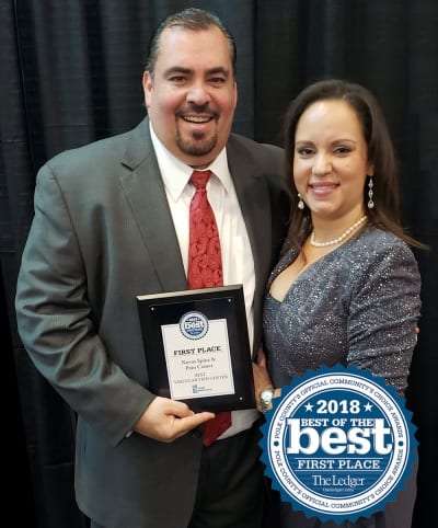 Dr. Torres and wife with 2018 Best of the Best Award in Lakeland, Florida