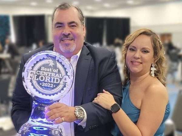 Dr. Torres with Award and Yasmin Torres